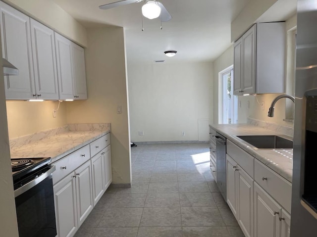 1608 Venetian Dr, Key West, FL 33040 - kitchen with appliances with stainless steel finishes, white cabinets, and a ceiling fan