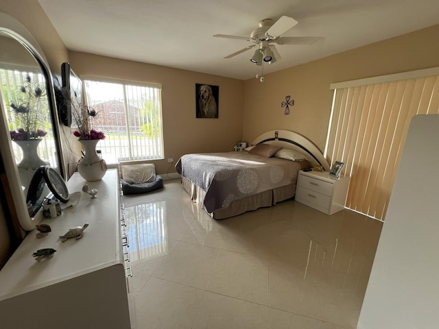 tiled bedroom with ceiling fan