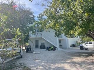 view of side of property with stairs