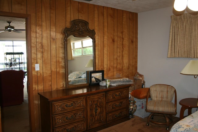 bedroom with wooden walls