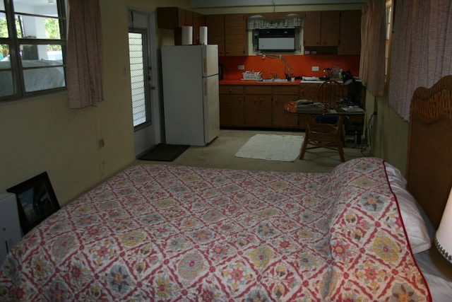 interior space with white fridge and sink