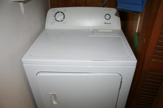 clothes washing area featuring washer / dryer