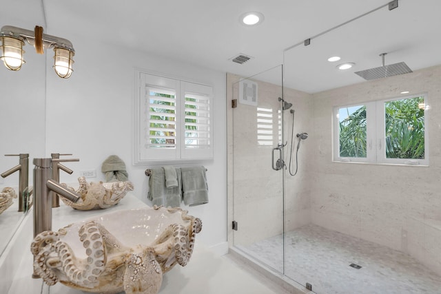 bathroom featuring a shower stall, visible vents, a sink, and recessed lighting