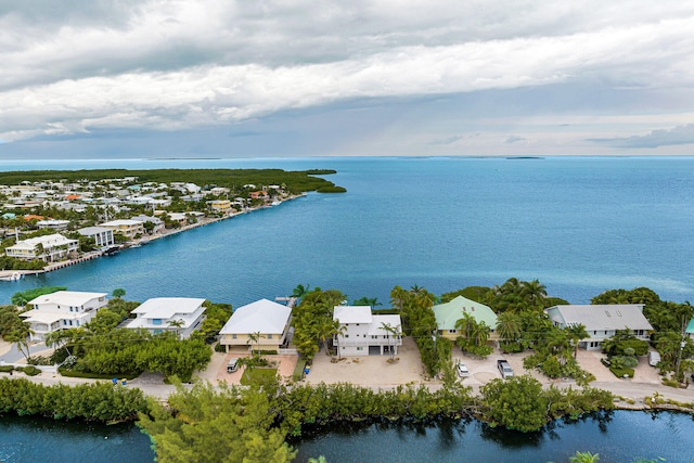 bird's eye view featuring a water view and a residential view