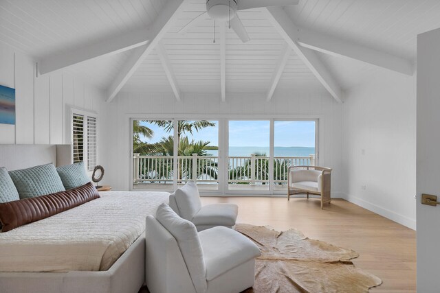 bedroom featuring light hardwood / wood-style floors, multiple windows, and access to outside