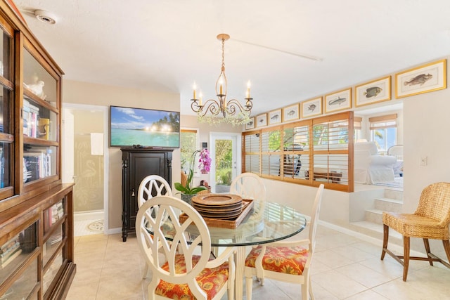 dining space with an inviting chandelier and light tile patterned floors