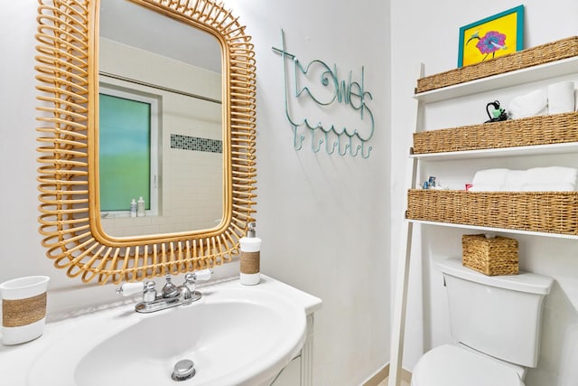 bathroom featuring sink and toilet