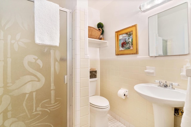 bathroom with toilet, an enclosed shower, tile patterned flooring, and tile walls