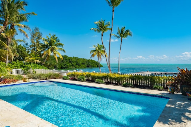 view of pool featuring a water view