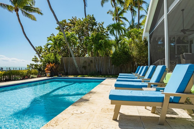 view of pool featuring ceiling fan