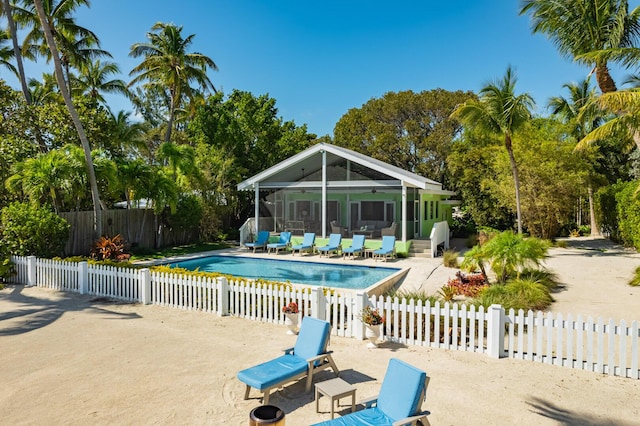 view of pool with a patio and a sunroom