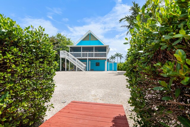 back of property featuring a sunroom