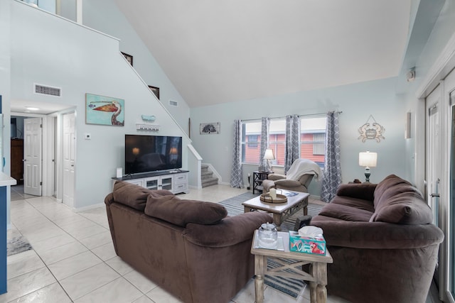 tiled living room with high vaulted ceiling