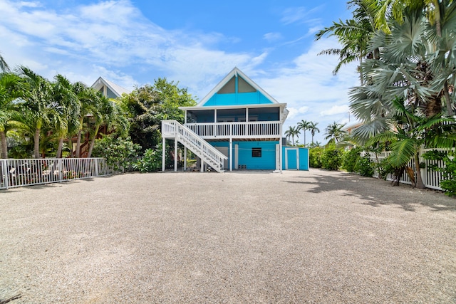 view of front of property featuring a sunroom