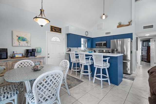 tiled dining area with high vaulted ceiling