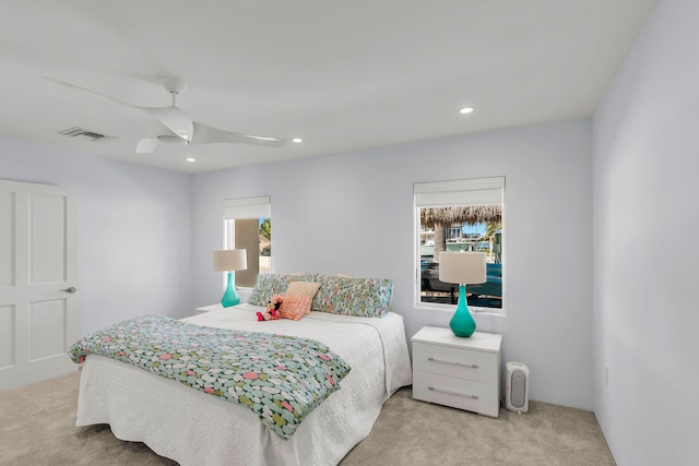 carpeted bedroom with ceiling fan