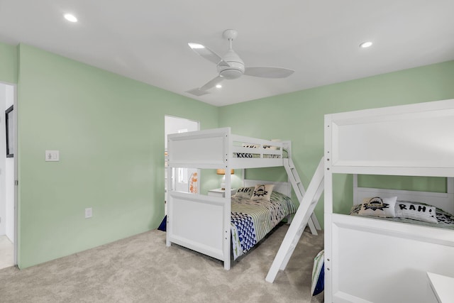 bedroom featuring light colored carpet and ceiling fan