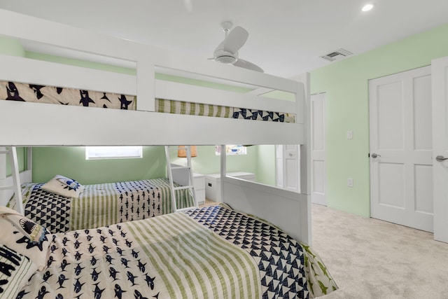 carpeted bedroom with ceiling fan