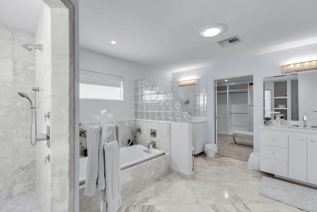 bathroom with vanity and plus walk in shower