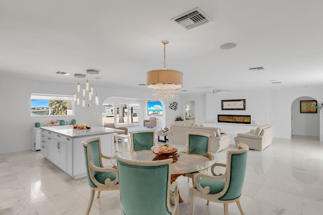 dining area featuring a notable chandelier