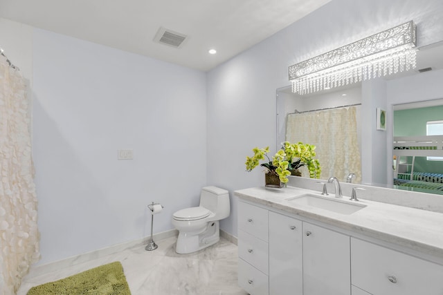 bathroom with vanity and toilet