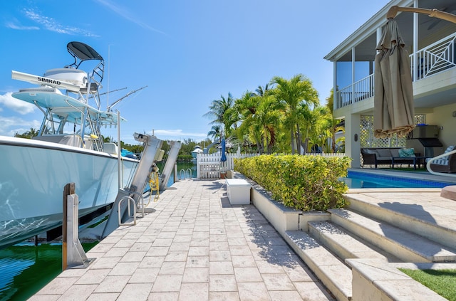 view of property's community with a boat dock and boat lift