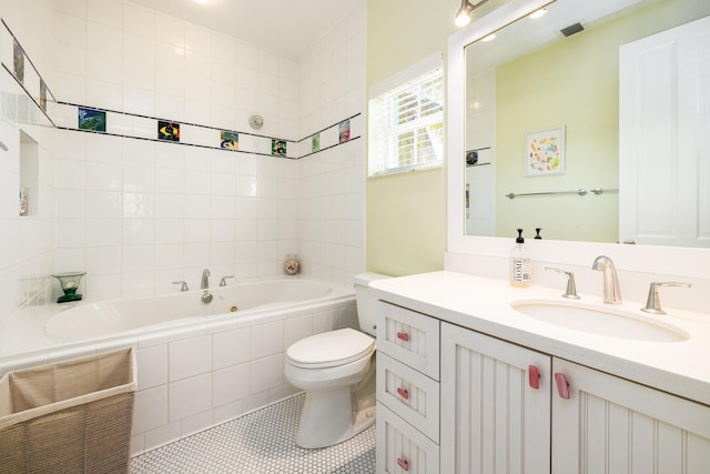full bathroom featuring toilet, visible vents, tile patterned flooring, tiled tub, and vanity