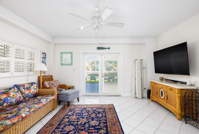 living room with light tile patterned floors and ceiling fan