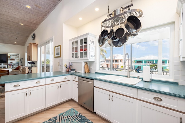 kitchen with recessed lighting, dishwasher, a healthy amount of sunlight, and a sink