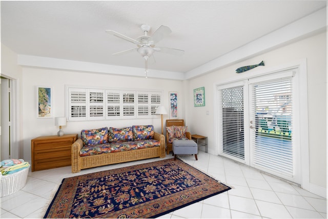 living area featuring light tile patterned floors and a ceiling fan