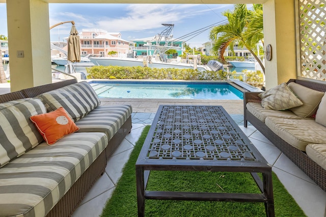 outdoor pool featuring a patio and an outdoor living space