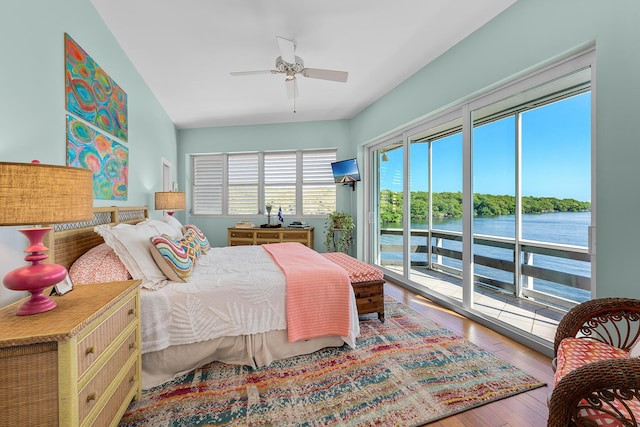 bedroom with access to outside, hardwood / wood-style flooring, and a ceiling fan