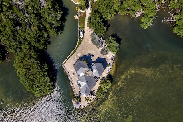 aerial view of property and surrounding area featuring a large body of water