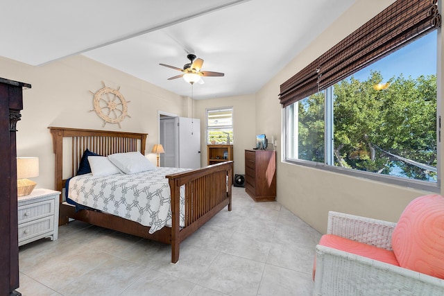 bedroom featuring light tile patterned floors and ceiling fan