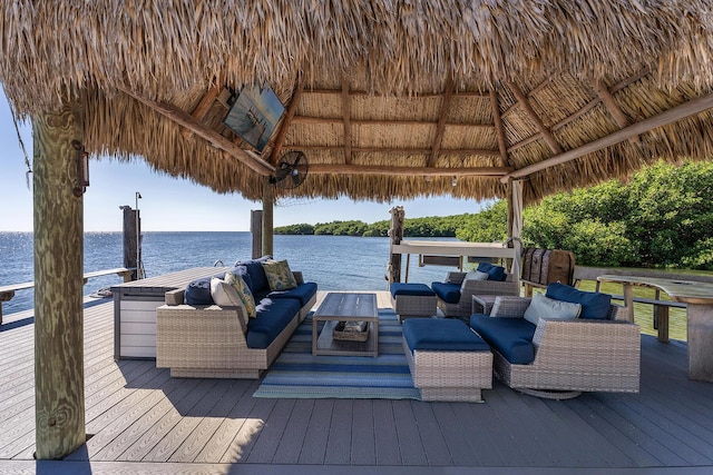 dock area with an outdoor living space, a gazebo, and a deck with water view