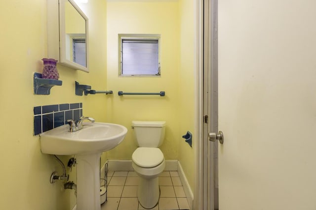 bathroom with tile patterned floors, toilet, and sink