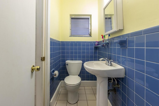 bathroom featuring sink, tile patterned floors, and toilet