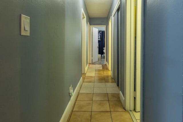 hallway featuring light tile patterned floors