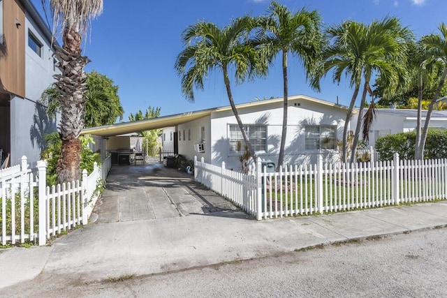 view of front of house featuring a carport