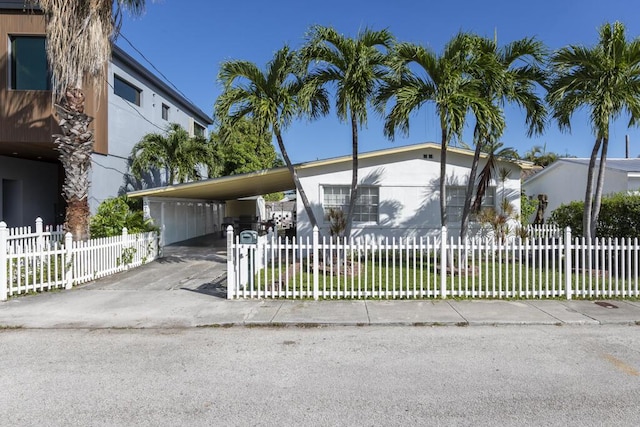 view of front of property featuring a carport