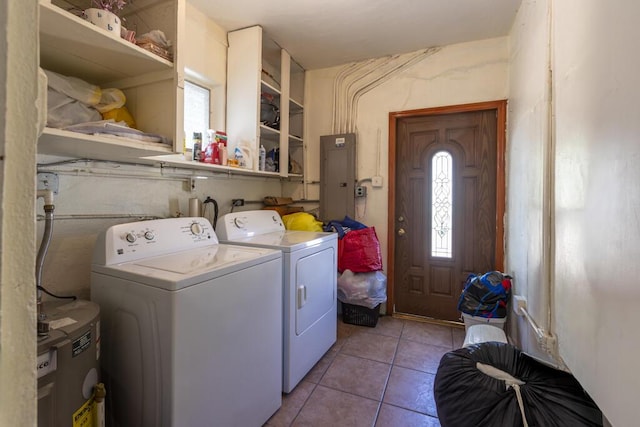 laundry room featuring electric panel, washer and dryer, and light tile patterned floors