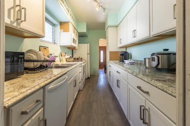 kitchen featuring dark wood-type flooring, dishwasher, light stone countertops, and white cabinets