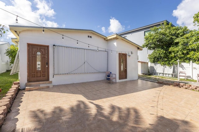 view of front of property featuring a patio area