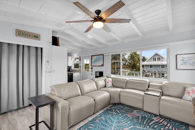 living room with lofted ceiling with beams, a healthy amount of sunlight, ceiling fan, and light hardwood / wood-style flooring