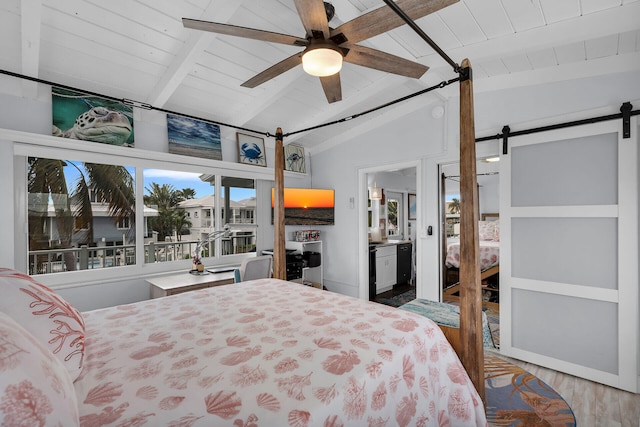 bedroom featuring lofted ceiling with beams, wood-type flooring, ceiling fan, wood ceiling, and a barn door