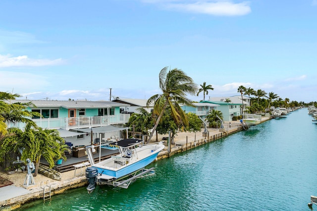 dock area featuring a water view and a balcony