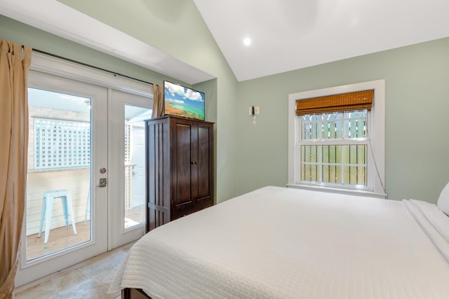 tiled bedroom featuring multiple windows, access to outside, french doors, and vaulted ceiling