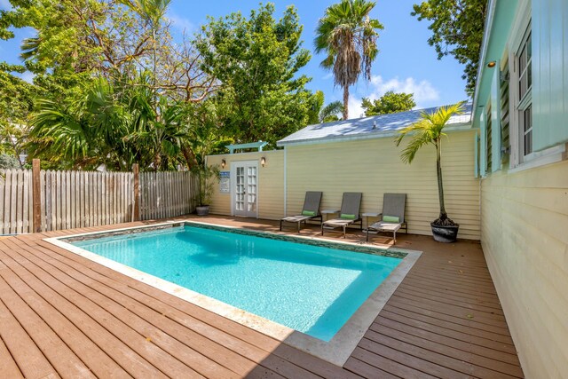 view of swimming pool featuring a deck