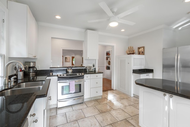 kitchen featuring sink, white cabinetry, ornamental molding, ceiling fan, and stainless steel appliances