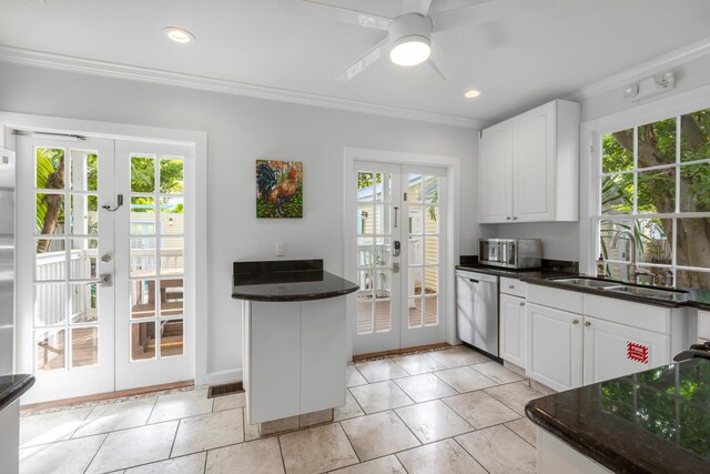 kitchen featuring sink, french doors, and white cabinets